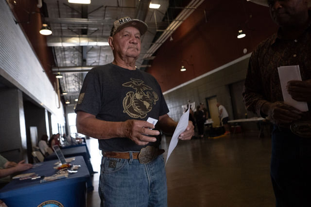 A veteran visiting an organization's table at the Resource Fair in Helena